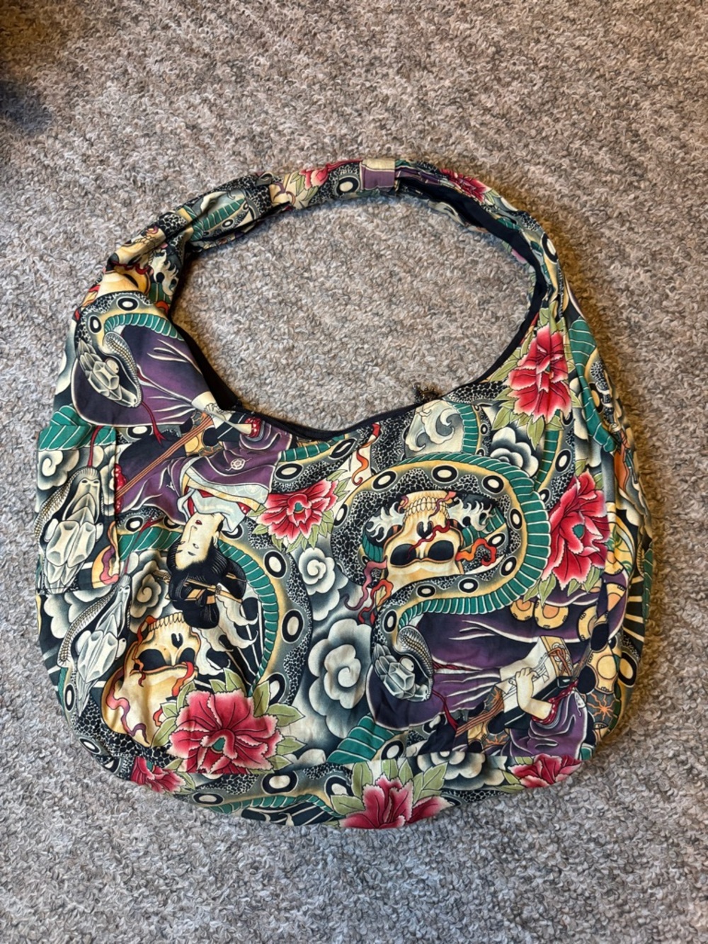 The Alexander Henry “Zen Charmer” tattoo flash print hobo shoulder bag